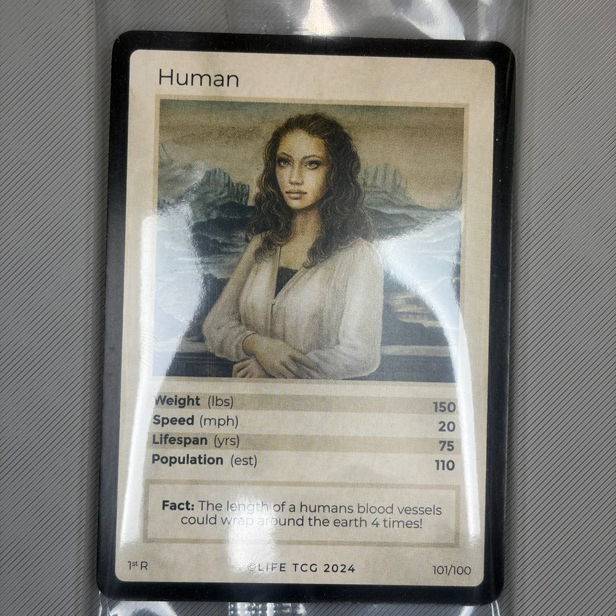 Human #101/100 | LIFE TCG | Mammals 1st Edition | Sealed Box Topper (front)